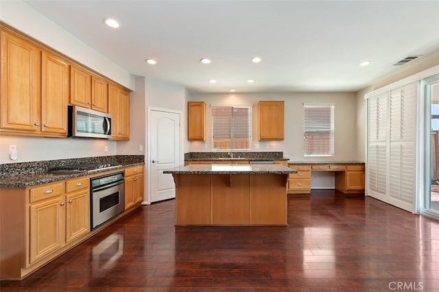 29855 Bay View Way, Menifee, CA 92584 - kitchen with appliances with stainless steel finishes, visible vents, dark wood-style floors, and a center island