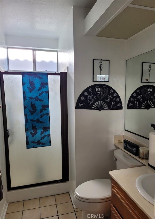 full bath with vanity, toilet, a shower stall, and tile patterned flooring