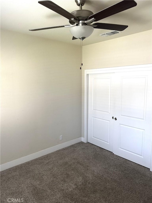16 Petaluma Ct, Chico, CA 95926 - unfurnished bedroom featuring dark carpet, baseboards, ceiling fan, and a closet