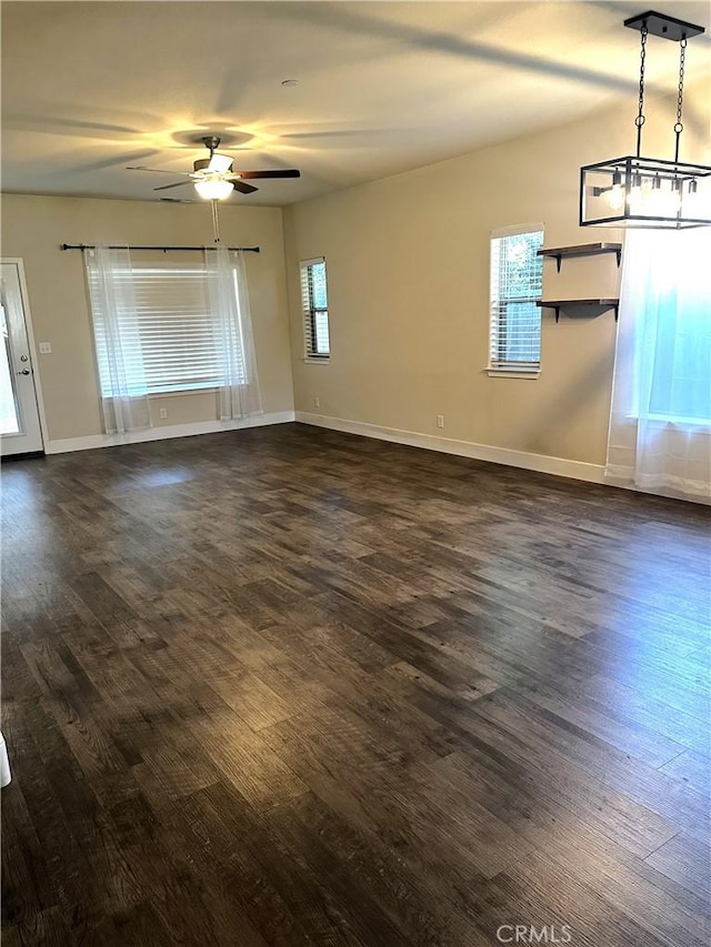 16 Petaluma Ct, Chico, CA 95926 - unfurnished living room featuring ceiling fan, dark wood-style flooring, and baseboards