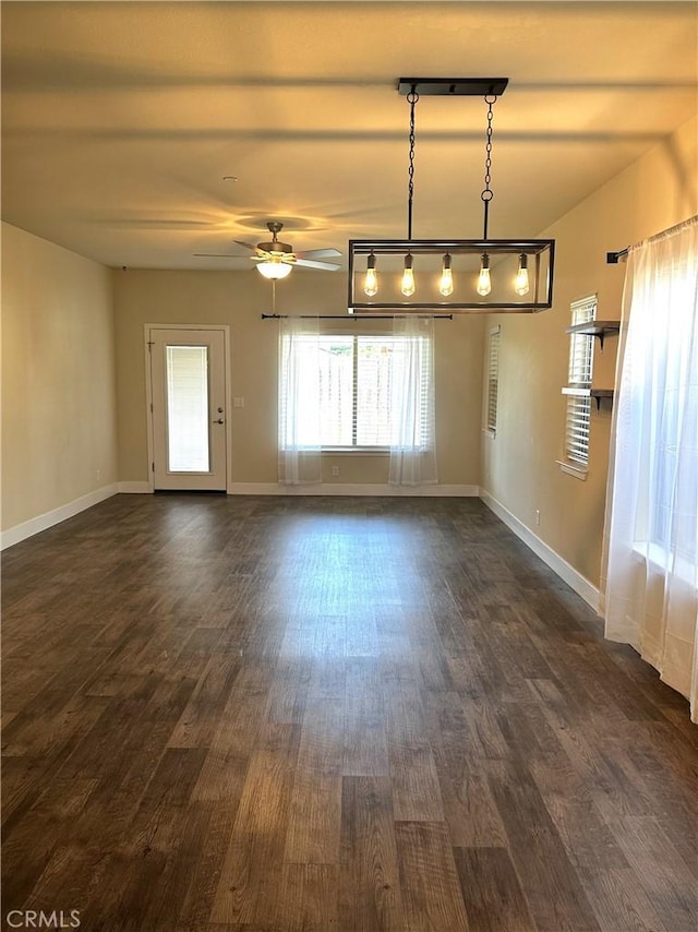 16 Petaluma Ct, Chico, CA 95926 - empty room featuring dark wood-type flooring, ceiling fan, and baseboards