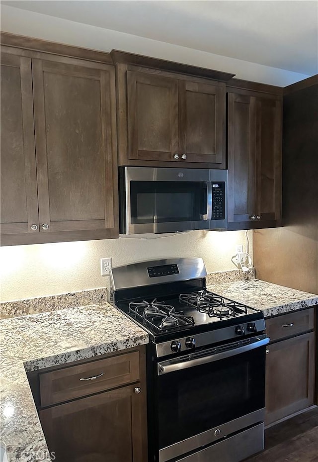 16 Petaluma Ct, Chico, CA 95926 - kitchen featuring stainless steel appliances, dark brown cabinetry, and light stone counters