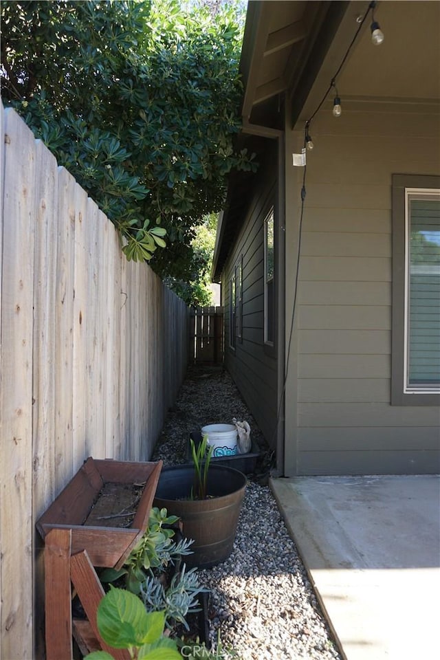 16 Petaluma Ct, Chico, CA 95926 - view of side of home featuring fence and a patio area