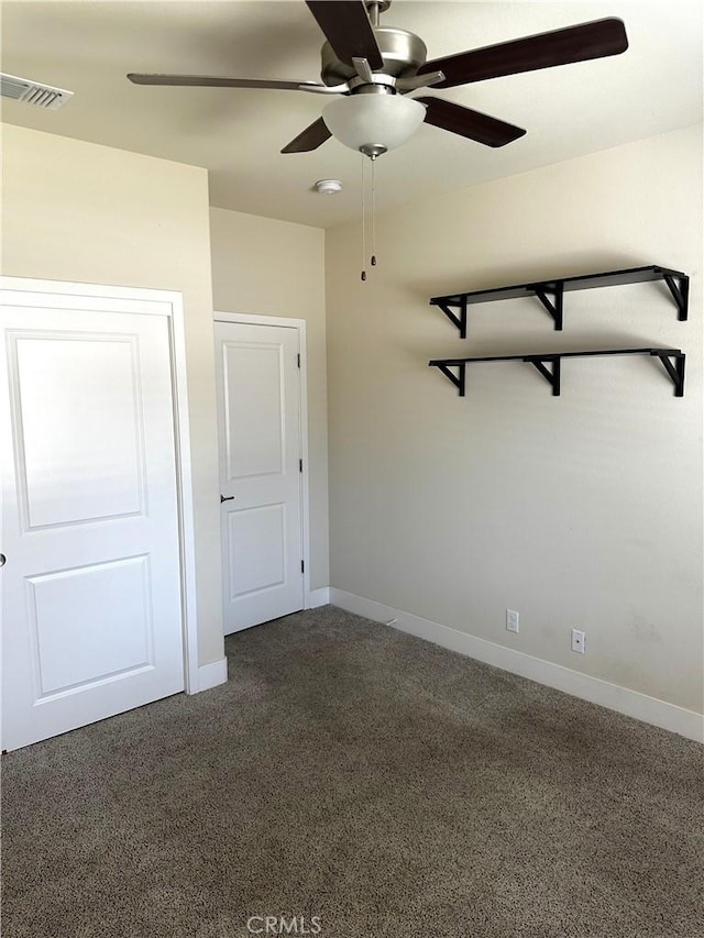 16 Petaluma Ct, Chico, CA 95926 - empty room with a ceiling fan, dark colored carpet, and baseboards