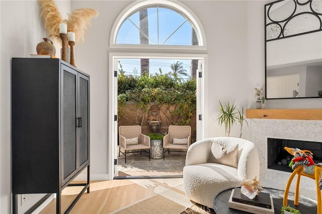doorway featuring a fireplace and wood finished floors