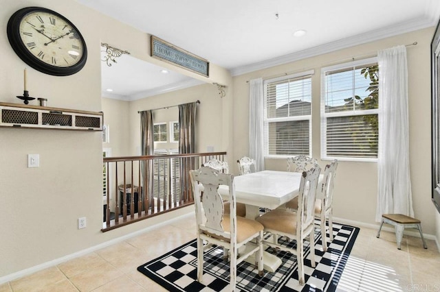 dining room with tile patterned floors, a wealth of natural light, and crown molding