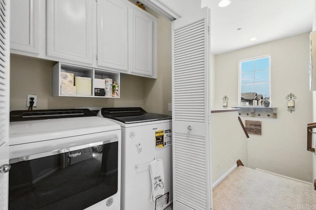 laundry area with recessed lighting, independent washer and dryer, cabinet space, carpet, and baseboards