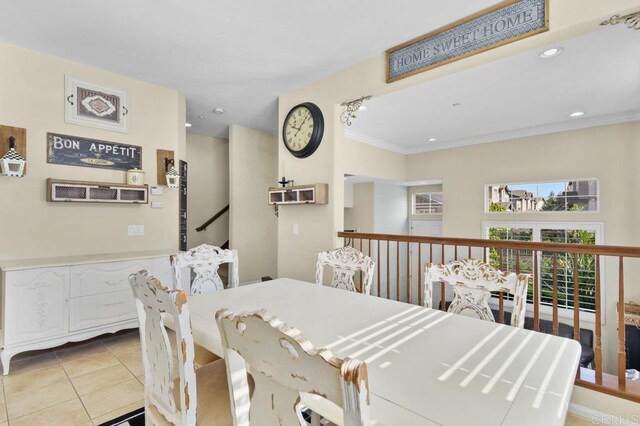 dining space featuring recessed lighting, light tile patterned floors, and crown molding