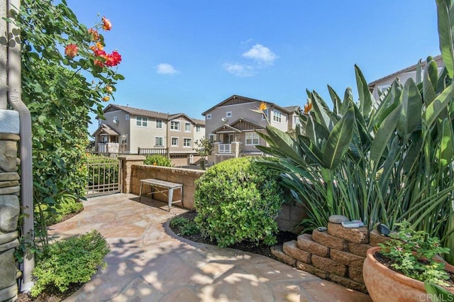 surrounding community featuring a patio and a residential view