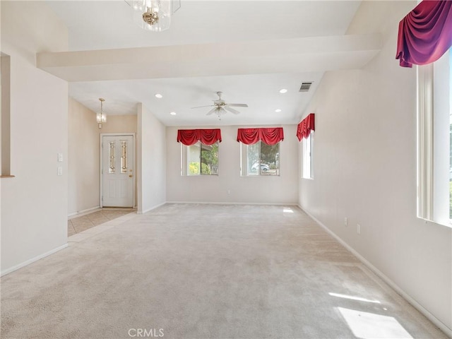 spare room featuring carpet flooring, recessed lighting, baseboards, and visible vents
