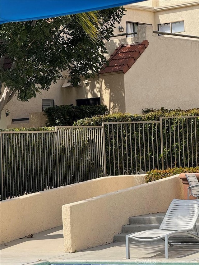 view of patio / terrace with fence