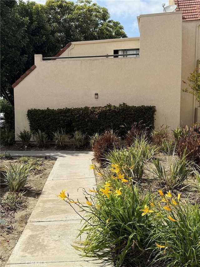 view of side of home featuring stucco siding