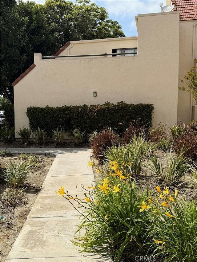 82 Largo St, Laguna Niguel, CA 92677 - view of side of home featuring stucco siding
