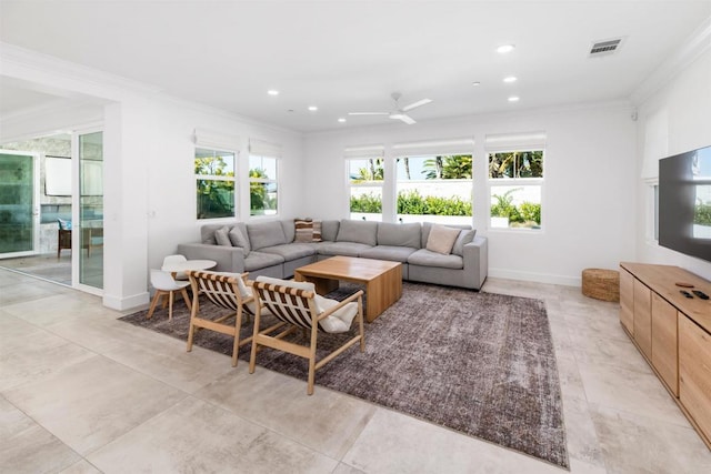 living area featuring baseboards, visible vents, ornamental molding, and recessed lighting