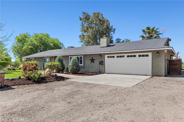 7440 Shale Rock Rd, Paso Robles, CA 93446 - ranch-style house with an attached garage, driveway, stucco siding, and a chimney