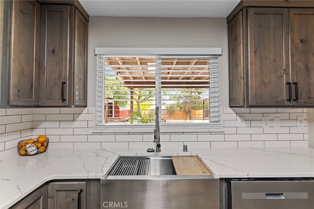 28646 Patti Ln, Menifee, CA 92585 - kitchen with stainless steel dishwasher, a sink, decorative backsplash, and dark brown cabinets