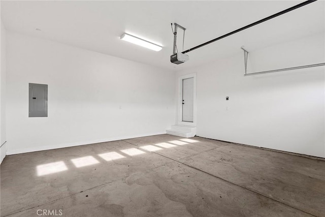 garage featuring a garage door opener and electric panel