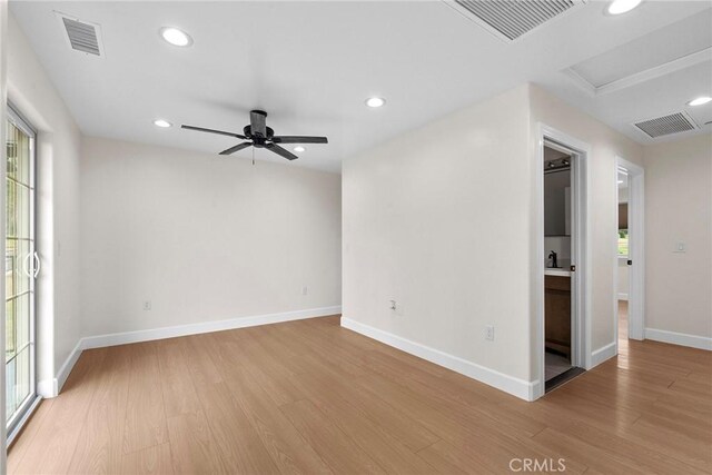 empty room featuring visible vents, a ceiling fan, recessed lighting, and light wood-style floors