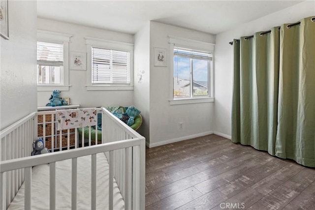105 Joyce Way, Pismo Beach, CA 93449 - bedroom with multiple windows, hardwood / wood-style flooring, and a nursery area