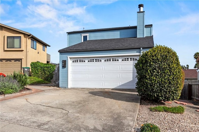 105 Joyce Way, Pismo Beach, CA 93449 - view of front facade featuring a garage, driveway, and a chimney