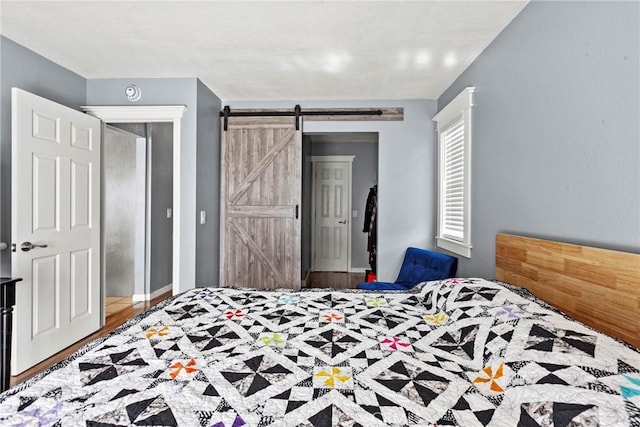 105 Joyce Way, Pismo Beach, CA 93449 - bedroom with a barn door and wood finished floors