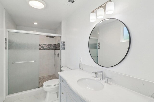 full bath featuring visible vents, a shower stall, toilet, and vanity