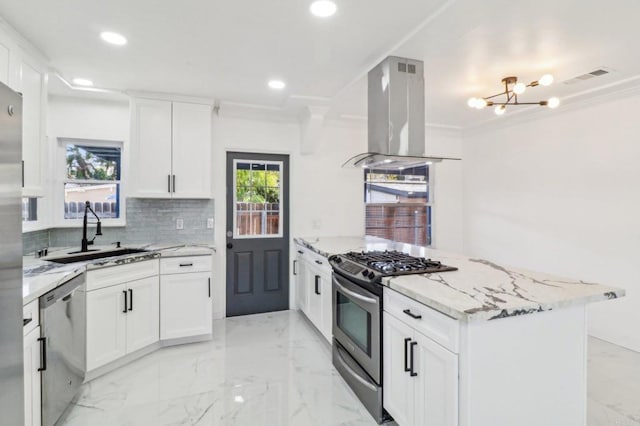 kitchen with recessed lighting, an inviting chandelier, a sink, island range hood, and appliances with stainless steel finishes