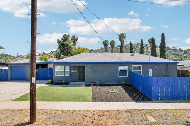 ranch-style house with a front lawn, a garage, driveway, stucco siding, and fence
