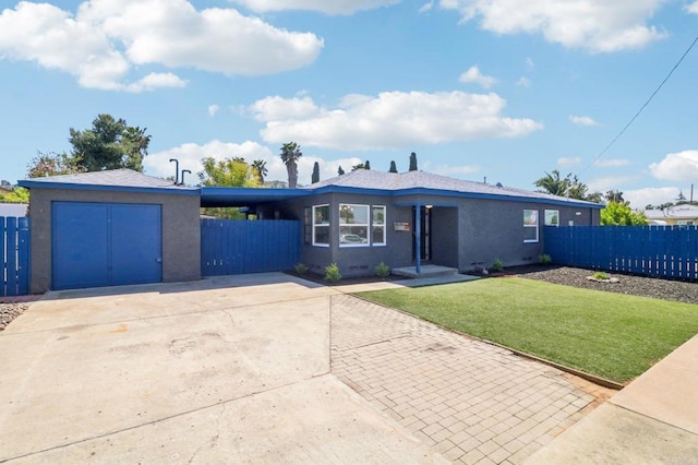 ranch-style house with driveway, fence, and stucco siding