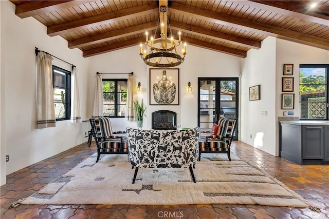 2020 N Victoria Dr, Santa Ana, CA 92706 - dining room featuring plenty of natural light, wooden ceiling, stone tile floors, a fireplace, and beamed ceiling
