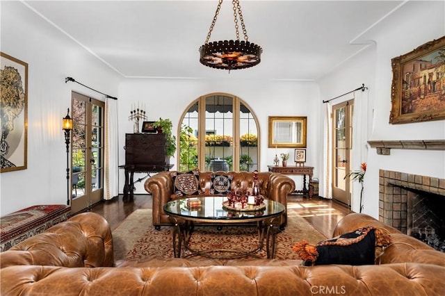2020 N Victoria Dr, Santa Ana, CA 92706 - living area with wood finished floors, a fireplace, and french doors