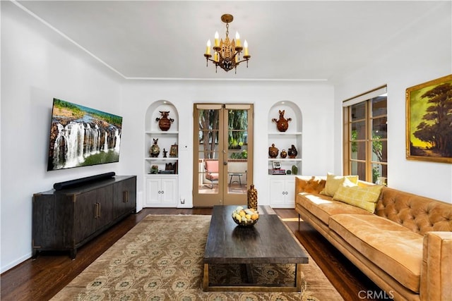 2020 N Victoria Dr, Santa Ana, CA 92706 - living room with built in shelves, a chandelier, wood finished floors, and plenty of natural light