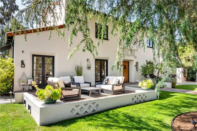 2020 N Victoria Dr, Santa Ana, CA 92706 - back of house with outdoor lounge area, stucco siding, and a lawn