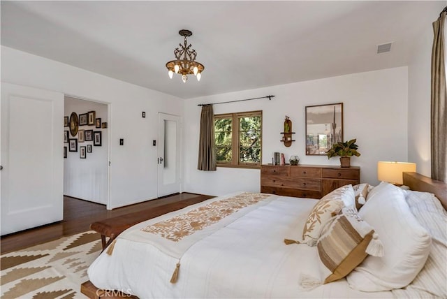 2020 N Victoria Dr, Santa Ana, CA 92706 - bedroom with a chandelier and wood finished floors