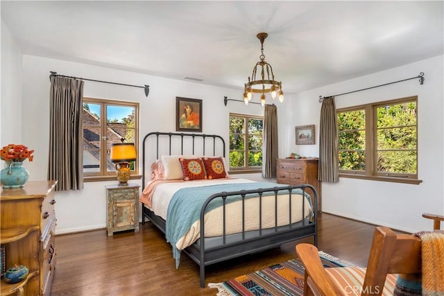 2020 N Victoria Dr, Santa Ana, CA 92706 - bedroom featuring multiple windows, wood finished floors, and baseboards