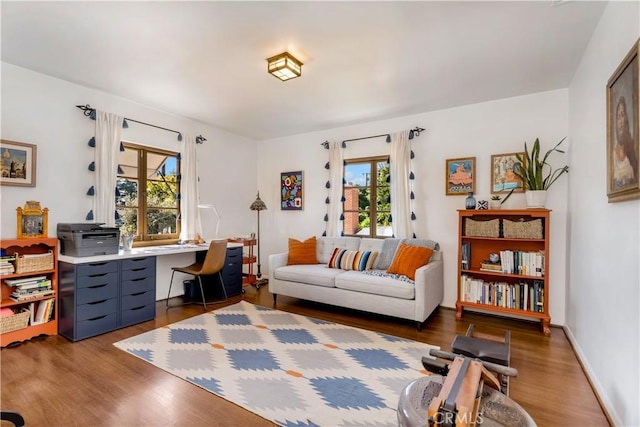 2020 N Victoria Dr, Santa Ana, CA 92706 - living area with wood finished floors, plenty of natural light, and a desk