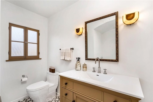 2020 N Victoria Dr, Santa Ana, CA 92706 - bathroom with baseboards, toilet, and vanity