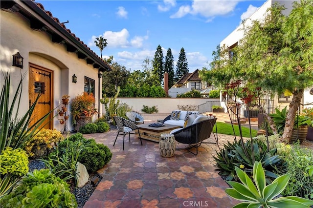 2020 N Victoria Dr, Santa Ana, CA 92706 - view of patio with fence and an outdoor living space with a fire pit