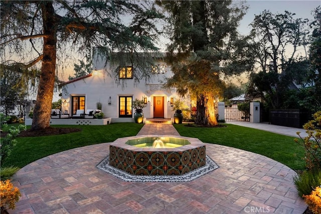 2020 N Victoria Dr, Santa Ana, CA 92706 - mediterranean / spanish-style house with a gate, fence, and stucco siding