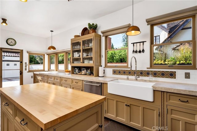 2020 N Victoria Dr, Santa Ana, CA 92706 - kitchen with wooden counters, a sink, stainless steel dishwasher, glass insert cabinets, and healthy amount of natural light