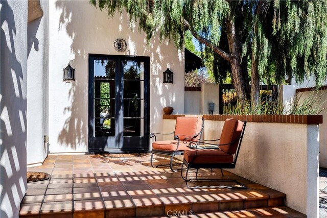 2020 N Victoria Dr, Santa Ana, CA 92706 - property entrance featuring stucco siding, fence, and a patio