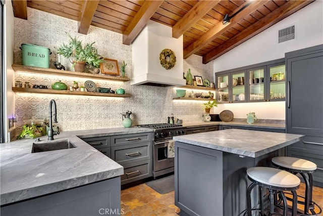 2020 N Victoria Dr, Santa Ana, CA 92706 - kitchen with open shelves, high end stainless steel range, wood ceiling, gray cabinetry, and a sink