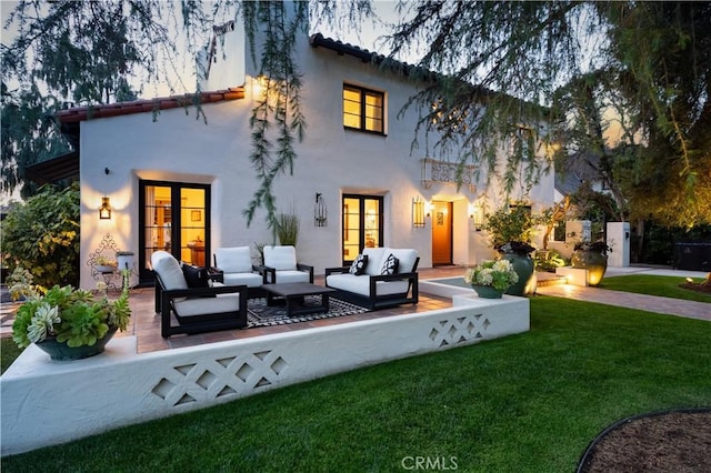 2020 N Victoria Dr, Santa Ana, CA 92706 - rear view of house with an outdoor hangout area, stucco siding, a yard, and french doors