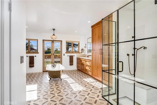 2020 N Victoria Dr, Santa Ana, CA 92706 - full bath with french doors, healthy amount of natural light, a stall shower, a freestanding tub, and recessed lighting