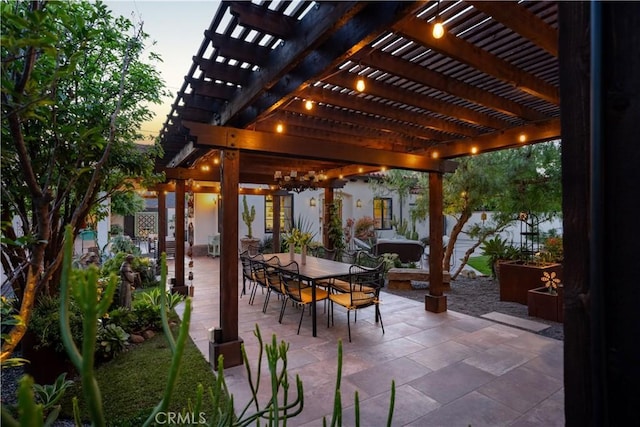 2020 N Victoria Dr, Santa Ana, CA 92706 - patio terrace at dusk featuring outdoor dining area, a pergola, and fence