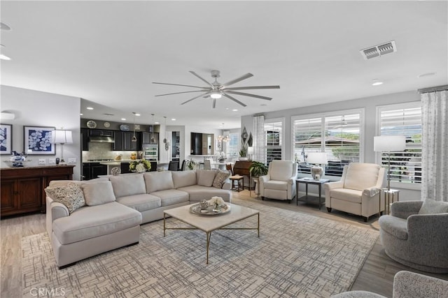 28934 Rangeview Dr, Murrieta, CA 92563 - living room featuring light wood-style flooring, a ceiling fan, and recessed lighting