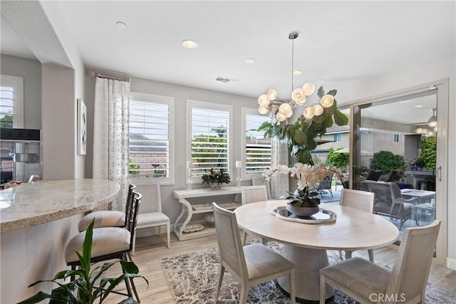 28934 Rangeview Dr, Murrieta, CA 92563 - dining room featuring light wood finished floors, a chandelier, baseboards, and recessed lighting