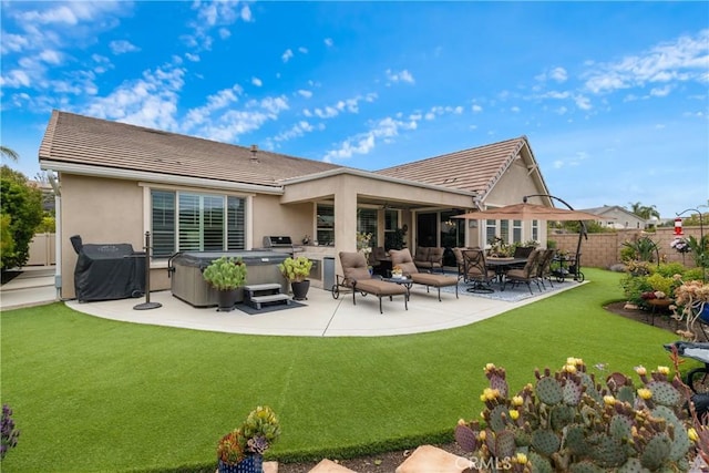 28934 Rangeview Dr, Murrieta, CA 92563 - back of property with a hot tub, a patio, a tiled roof, and stucco siding