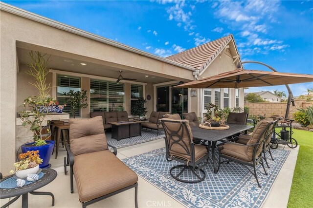 28934 Rangeview Dr, Murrieta, CA 92563 - view of patio featuring an outdoor hangout area, ceiling fan, outdoor dining area, and fence
