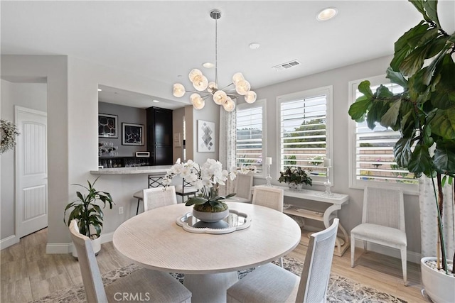 28934 Rangeview Dr, Murrieta, CA 92563 - dining room with light wood-style flooring, baseboards, a chandelier, and recessed lighting